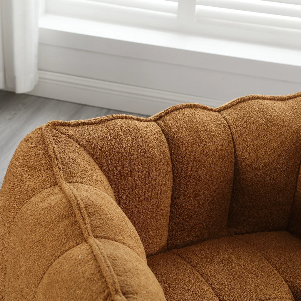 Brown soft square bean bag chair with footstool by eprolo in a bright room.