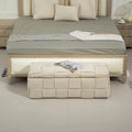 Beige eprolo cushioned fabric storage ottoman stool at the foot of a bed.