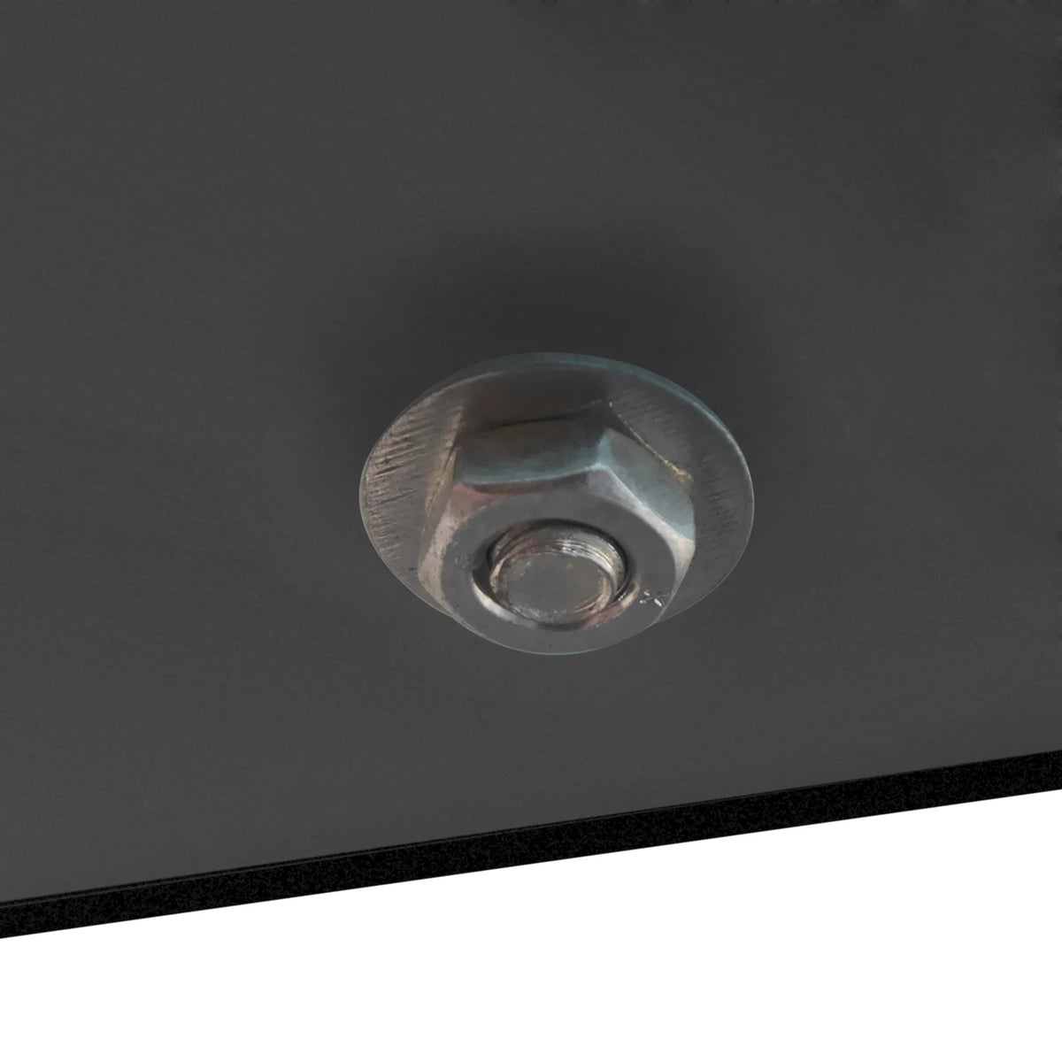 Close-up of a silver metal bolt securing the black frame of an eprolo coffee table.