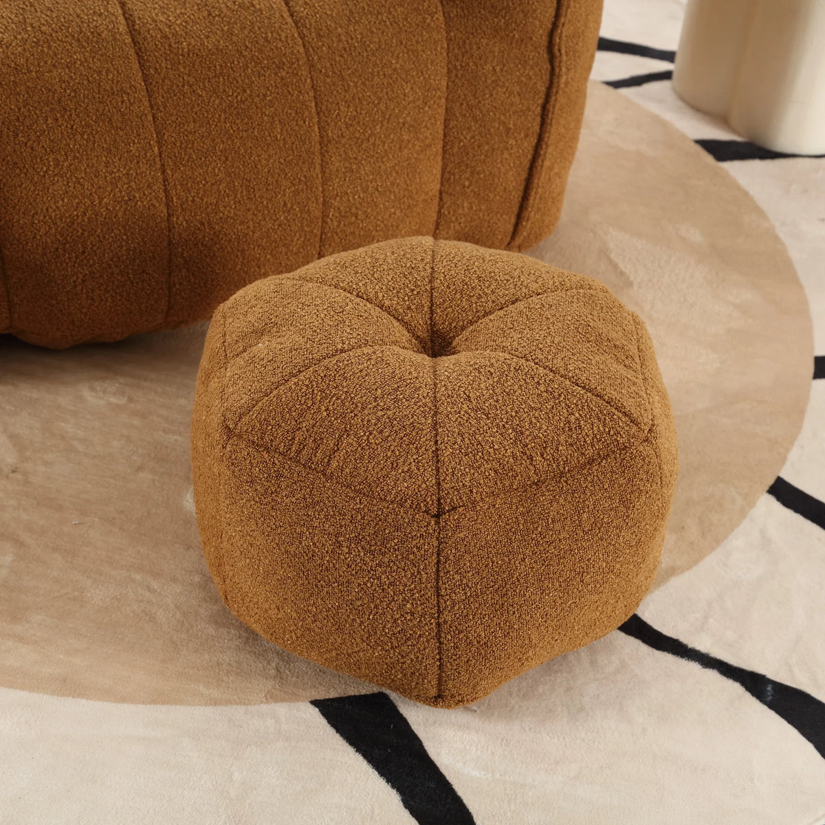 Brown eprolo soft square bean bag chair and matching footstool on a patterned rug.