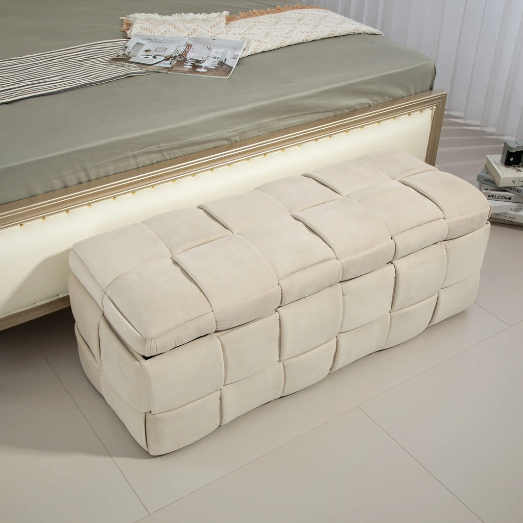 Beige eprolo cushioned fabric storage ottoman chair at the foot of a bed.