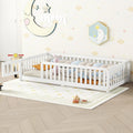 White eprolo twin size floor bed for kids with safety guardrails and side door in a nursery