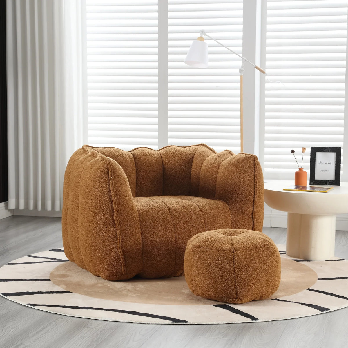 Brown eprolo soft square bean bag chair with matching footstool on a patterned rug.