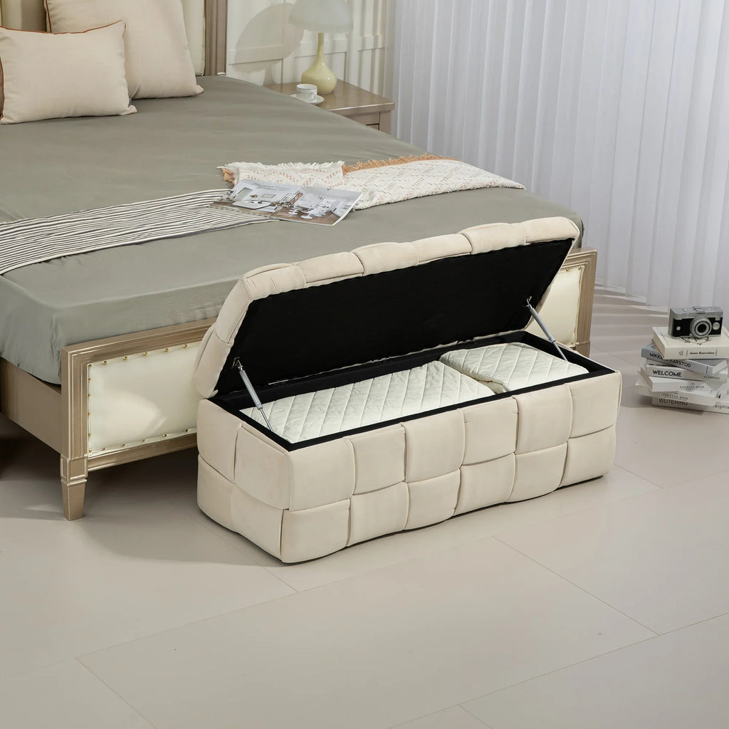 Beige eprolo fabric storage ottoman chair with safety hinge at the foot of a bed.