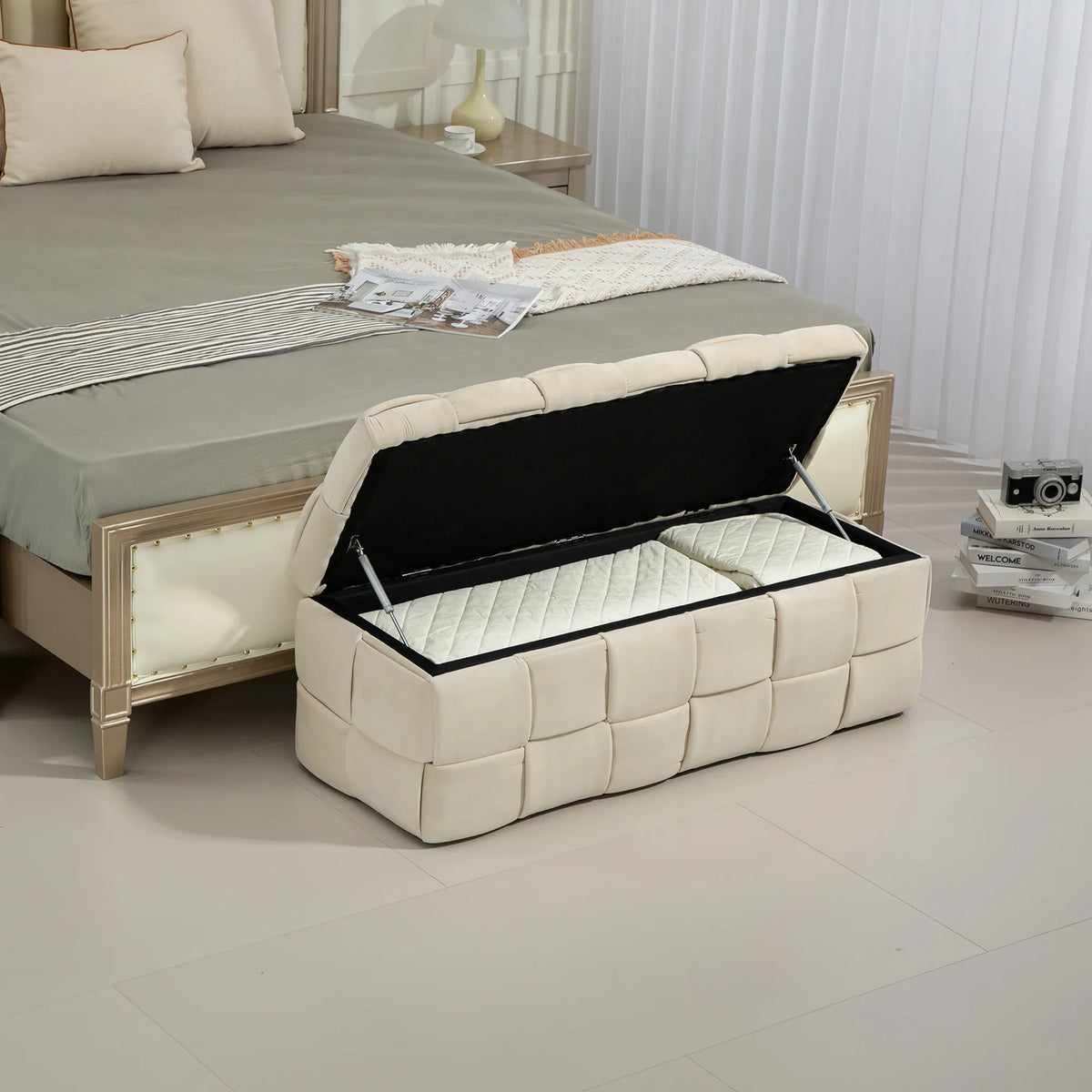 Beige eprolo fabric storage ottoman chair with safety hinge at the foot of a bed.
