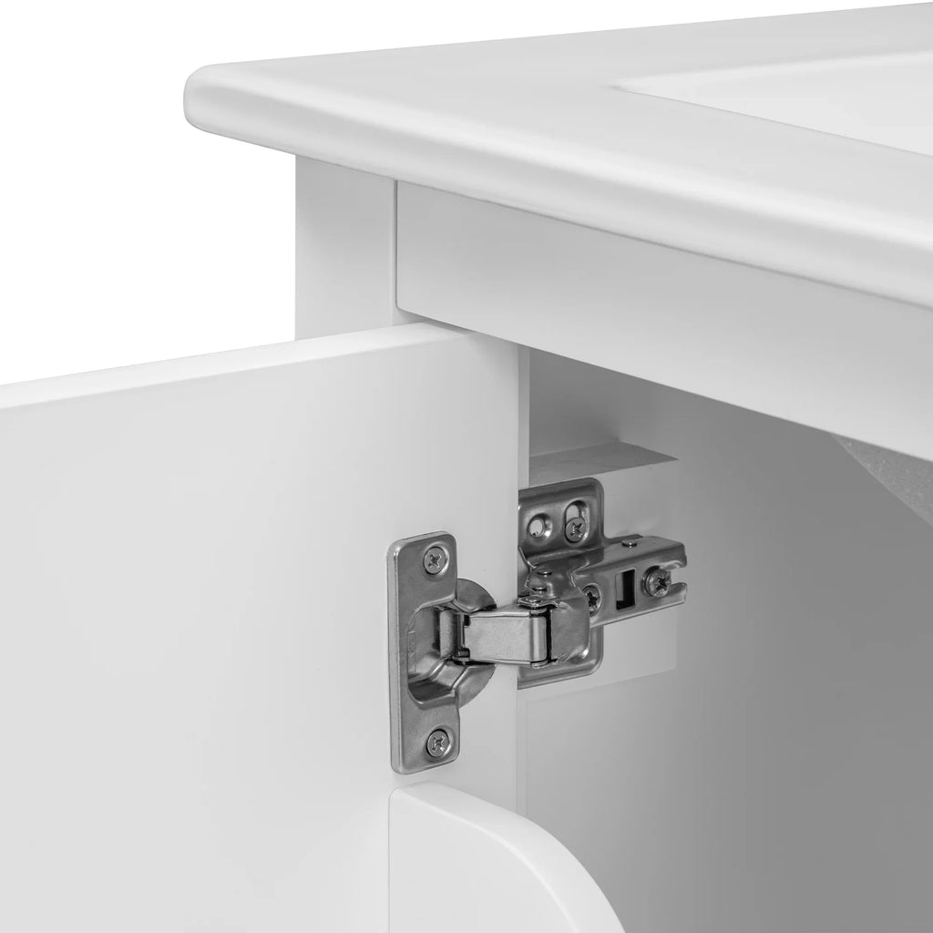 Close-up of a silver metal hinge on a white eprolo bathroom vanity cabinet door.