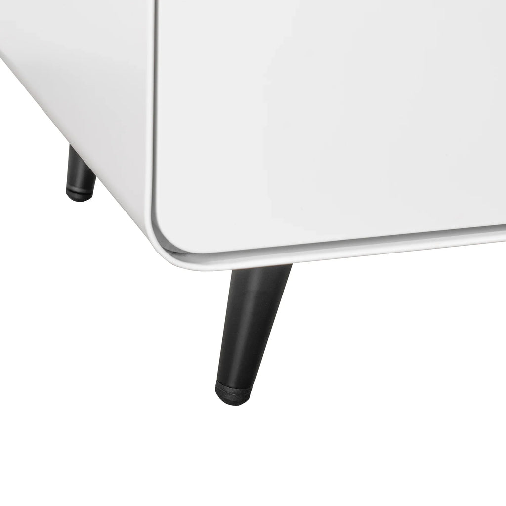 Close-up of black tapered metal legs on an eprolo white modern night stand storage cabinet.