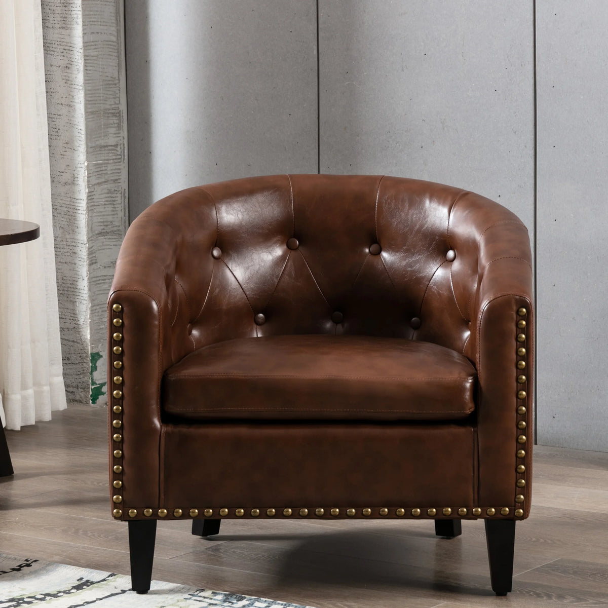 Brown PU leather tufted barrel chair with gold nailhead trim by eprolo
