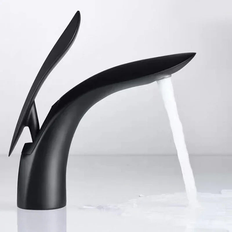 Modern matte black creative personalized bathroom basin faucet by eprolo with flowing water