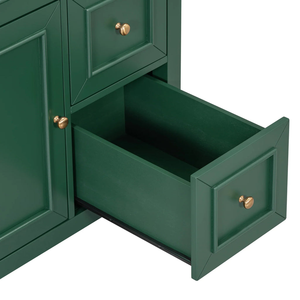 Open drawer and cabinet door of an eprolo green solid wood bathroom vanity with gold knobs.