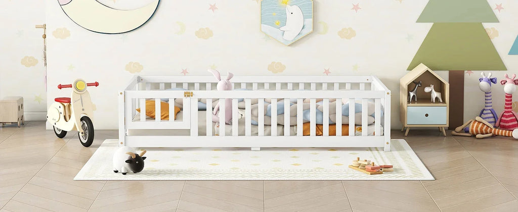 White eprolo twin size floor bed with safety guardrails in a decorated nursery.