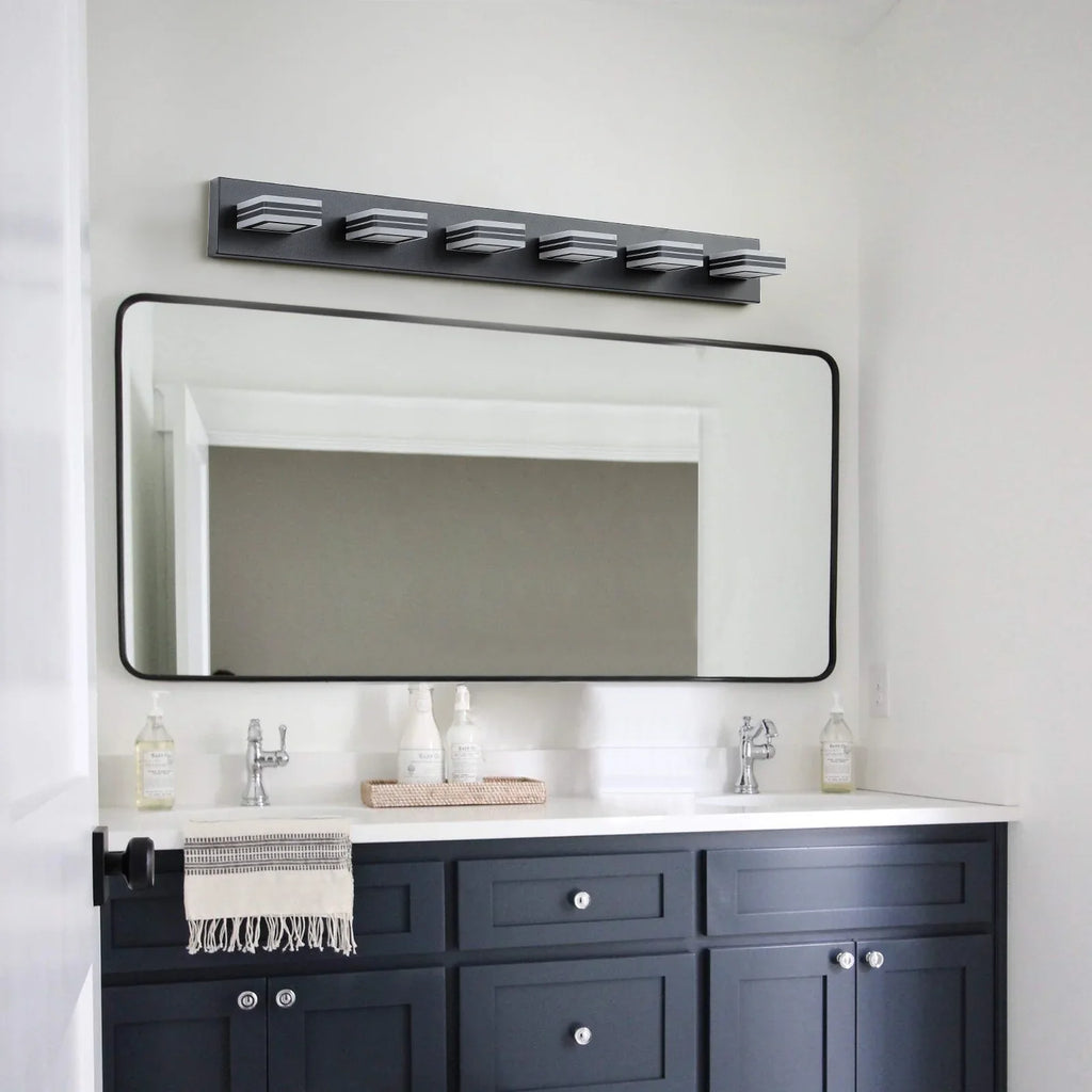 eprolo modern black 6-light LED bathroom vanity light above a mirror and dark blue cabinet