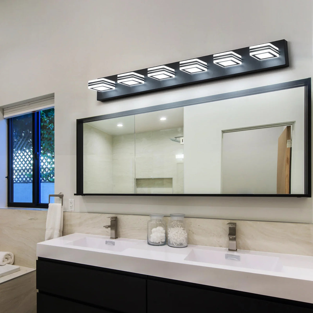 Modern eprolo LED black vanity lights installed over a large bathroom mirror.