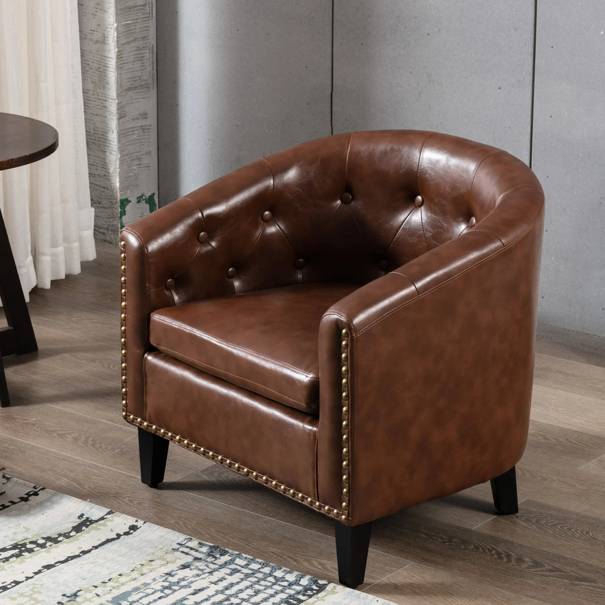 Brown PU leather tufted barrel chair with gold nailhead trim by eprolo