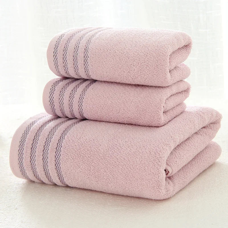Set of three thick, light pink cotton bath towels with decorative stripes by eprolo.